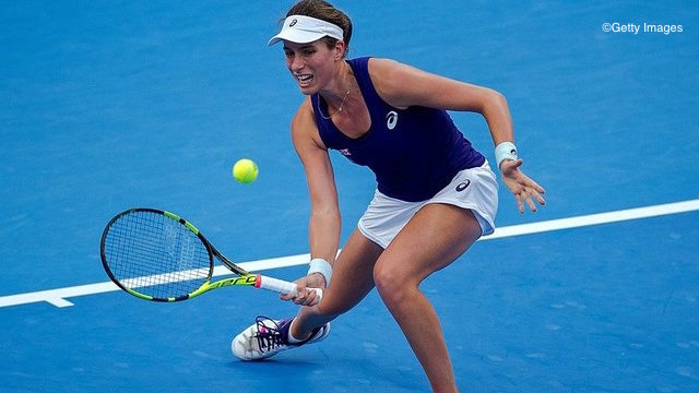 Johanna Konta of Britain hits a return against Agnieszka Radwanska of Poland during the women's singles final of the China Open tennis tournament in Beijing on October 9, 2016. / AFP / NICOLAS ASFOURI (Photo credit should read NICOLAS ASFOURI/AFP/Getty Images)