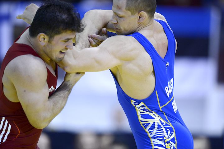 Hungary's Peter Bacsi (R) and Turkey's Selcuk Cebi wrestle during men's Greco-Roman style 80 kg weight category final match of the freestyle Wrestling European Championships in Vantaa, Finland on April 6, 2014. AFP PHOTO/ LEHTIKUVA / HEIKKI SAUKKOMAA *** FINLAND OUT ***